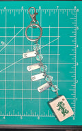 M A H J Keychain with Green Dragon (Tile is light green sparkle.)
